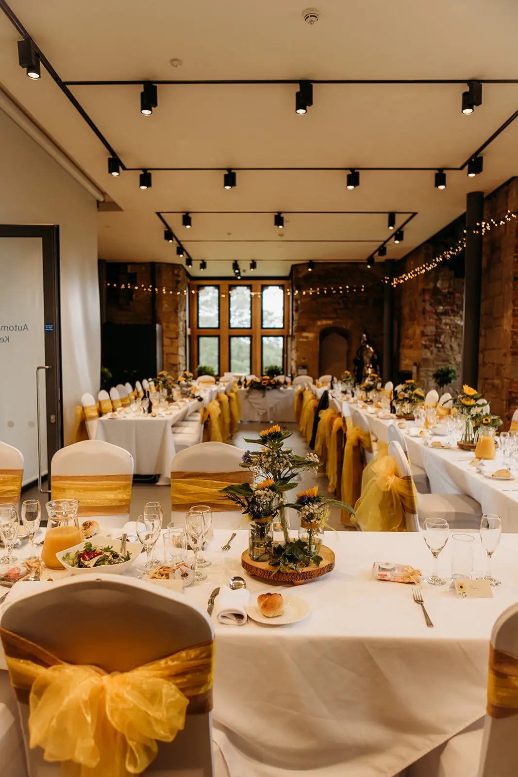 Wedding breakfast tables set inside the restored Hylton Castle