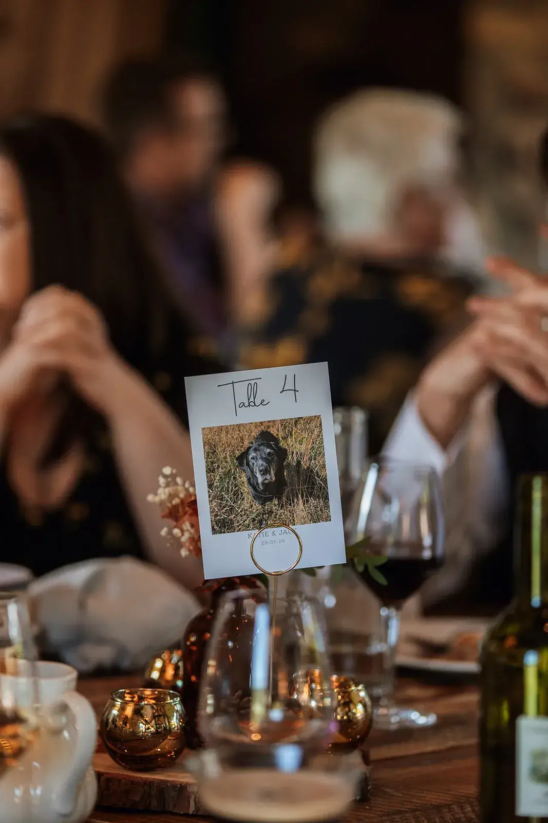 Dog-themed table centrepieces at Jack and Katie’s wedding